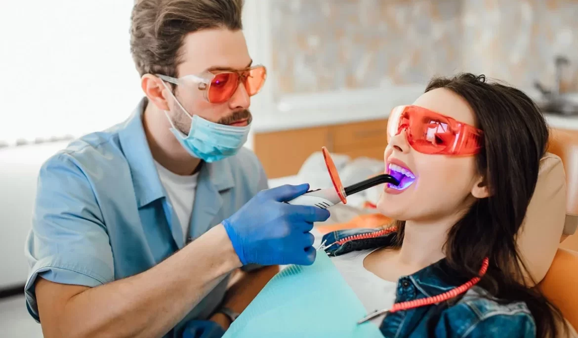 Dentist consulting patient in modern dental clinic