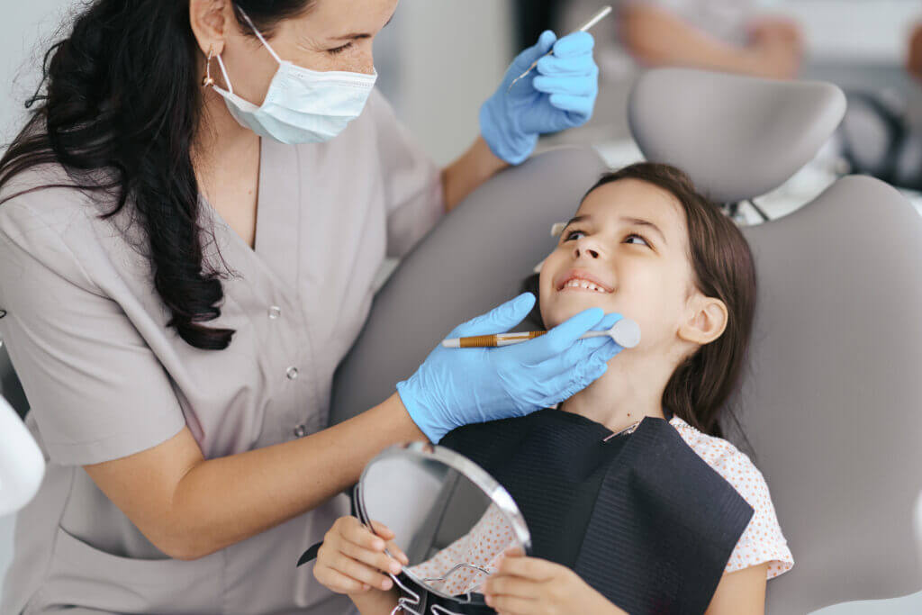 Child receiving gentle dental check-up at kids dental clinic